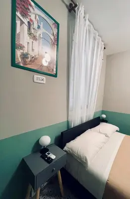 Letto o letti in una camera di Occhi di Napoli Experiential Relais