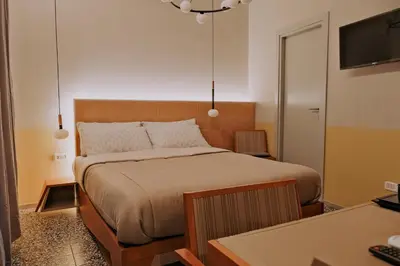 Letto o letti in una camera di Occhi di Napoli Experiential Relais