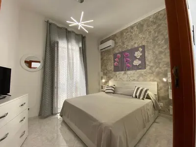 Letto o letti in una camera di Sea&sun apartament chiaia
