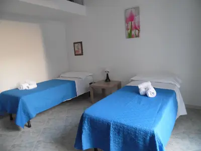 Letto o letti in una camera di Suite Donnaregina