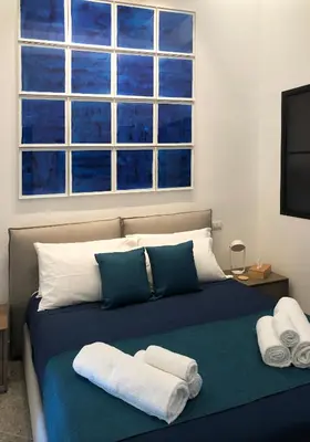 Letto o letti in una camera di Lily Apartment Napoli