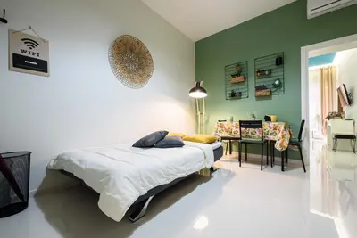 Letto o letti in una camera di Fermata Duomo