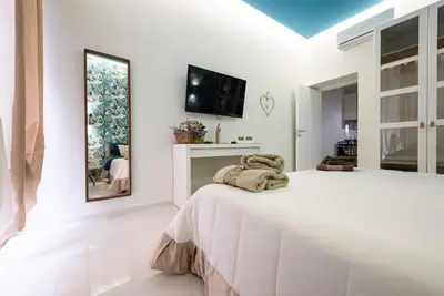 Letto o letti in una camera di Fermata Duomo