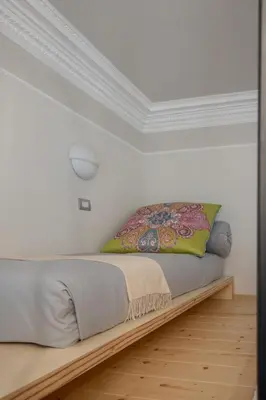 Letto o letti in una camera di MEA DOMUS Mergellina
