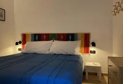 Letto o letti in una camera di La Casa Blu un oasi di tranquillità nel vivace cuore di Napoli