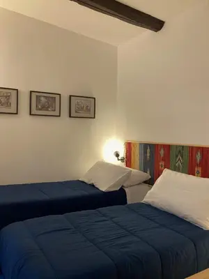 Letto o letti in una camera di La Casa Blu un oasi di tranquillità nel vivace cuore di Napoli