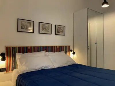 Letto o letti in una camera di La Casa Blu un oasi di tranquillità nel vivace cuore di Napoli