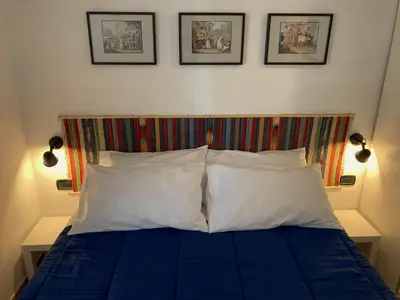 Letto o letti in una camera di La Casa Blu un oasi di tranquillità nel vivace cuore di Napoli
