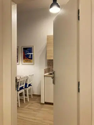 Cucina o angolo cottura di La Casa Blu un oasi di tranquillità nel vivace cuore di Napoli