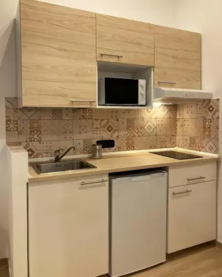 Cucina o angolo cottura di La Casa Blu un oasi di tranquillità nel vivace cuore di Napoli
