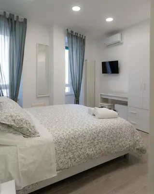 Letto o letti in una camera di Dimora Cavour