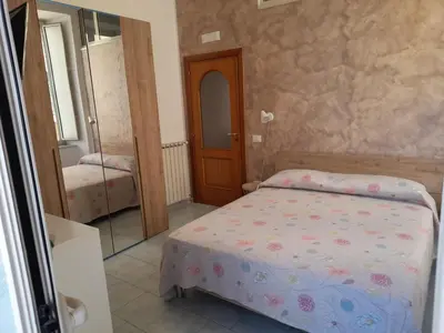 Letto o letti in una camera di IL VICOLETTO D'ORO
