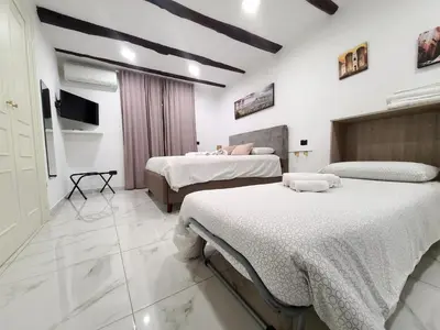 Letto o letti in una camera di la casa di patta a spaccanapoli