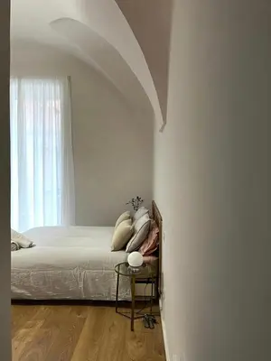 Letto o letti in una camera di La finestra su Chiaia