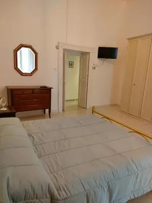 Letto o letti in una camera di Cisterna's rooms