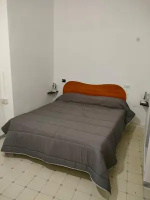 Letto o letti in una camera di Cisterna's rooms