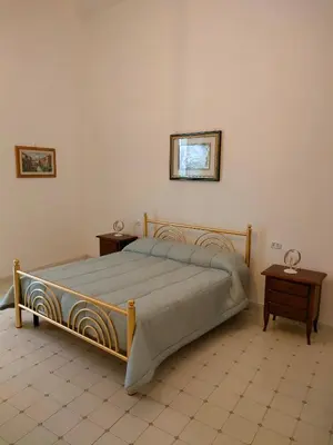 Letto o letti in una camera di Cisterna's rooms