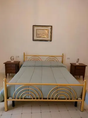 Letto o letti in una camera di Cisterna's rooms