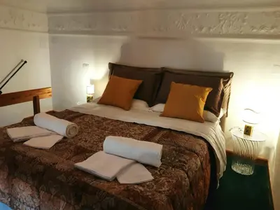 Letto o letti in una camera di Casa Antica Pizzofalcone