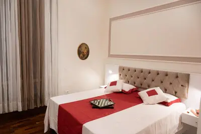 Letto o letti in una camera di Bernini House Naples