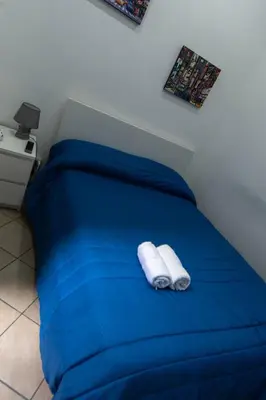 Letto o letti in una camera di Buona Napoli