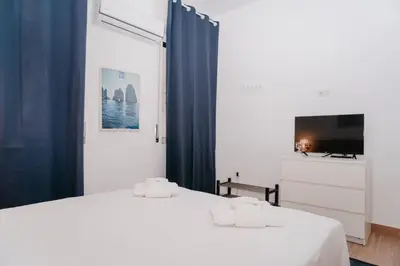 Letto o letti in una camera di Brombeis Fantastica by Casa Napoletana - Town center