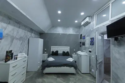 Letto o letti in una camera di Al Maradona