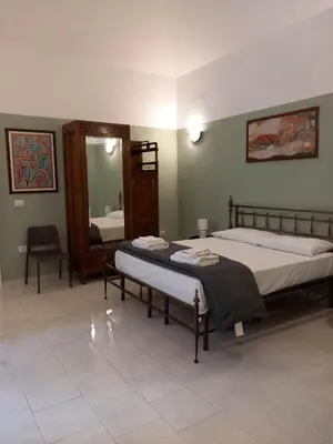 Letto o letti in una camera di Santa Chiara Home Spaccanapoli