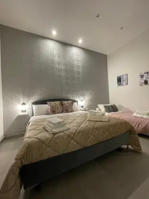 Letto o letti in una camera di Casa vacanza carmè