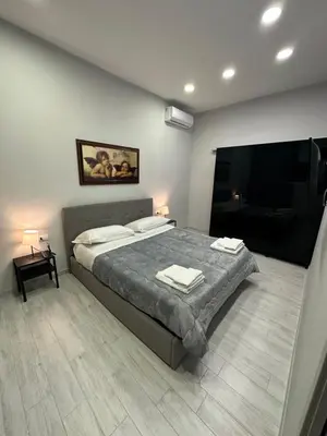 Letto o letti in una camera di Casa Nanninella Napoli centro