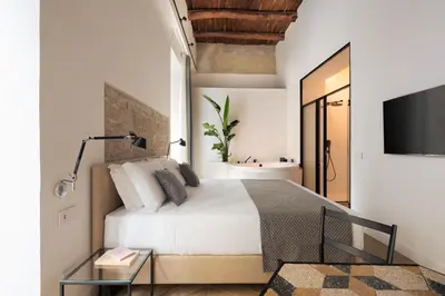 Letto o letti in una camera di Mirabilis Relais