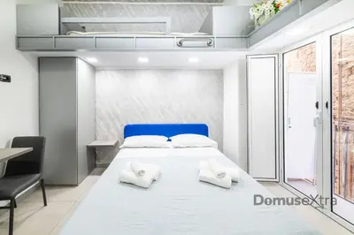 Letto o letti in una camera di La Casetta agli Orefici By DomusExtra