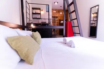 Letto o letti in una camera di Tiny Daisy House