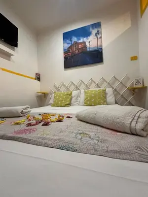 Letto o letti in una camera di Industrial Annarè