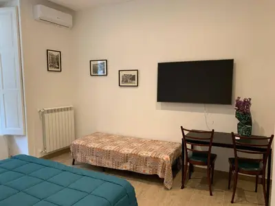 Letto o letti in una camera di FondacOlivella