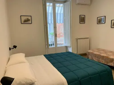 Letto o letti in una camera di FondacOlivella