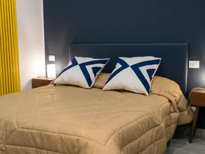 Letto o letti in una camera di Sant'Alfonso Rooms