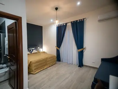 Letto o letti in una camera di Sant'Alfonso Rooms