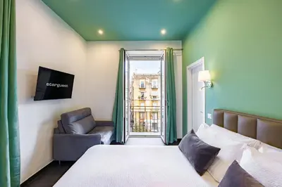 Letto o letti in una camera di Le Porte di Partenope