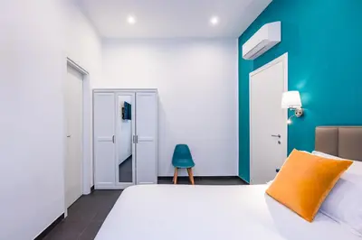 Letto o letti in una camera di Le Porte di Partenope