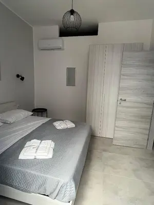 Letto o letti in una camera di Casa e Mariella