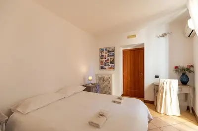 Letto o letti in una camera di COLORED HOUSE UNTIL 7 PEOPLE ABOVE SqPLEBISCITO