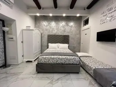 Letto o letti in una camera di Casa Tolentino al centro di Napoli