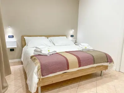 Letto o letti in una camera di Domus Pisanelli