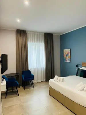 Letto o letti in una camera di Avio Suite