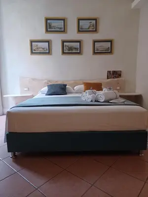 Letto o letti in una camera di Domus Duomo B&B Napoli