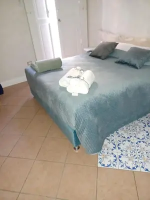 Letto o letti in una camera di Domus Duomo B&B Napoli