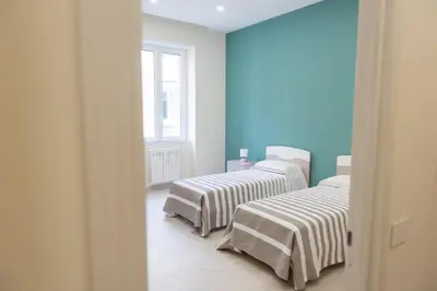 Letto o letti in una camera di La Suite tra i Musei