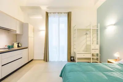 Letto o letti in una camera di Residenza Partanna by Napoliapartments