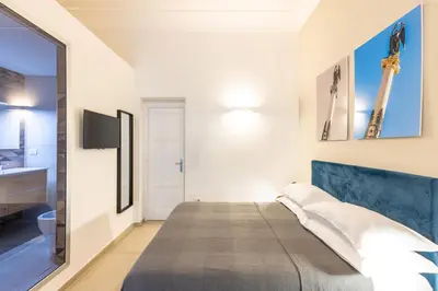 Letto o letti in una camera di Residenza Partanna by Napoliapartments